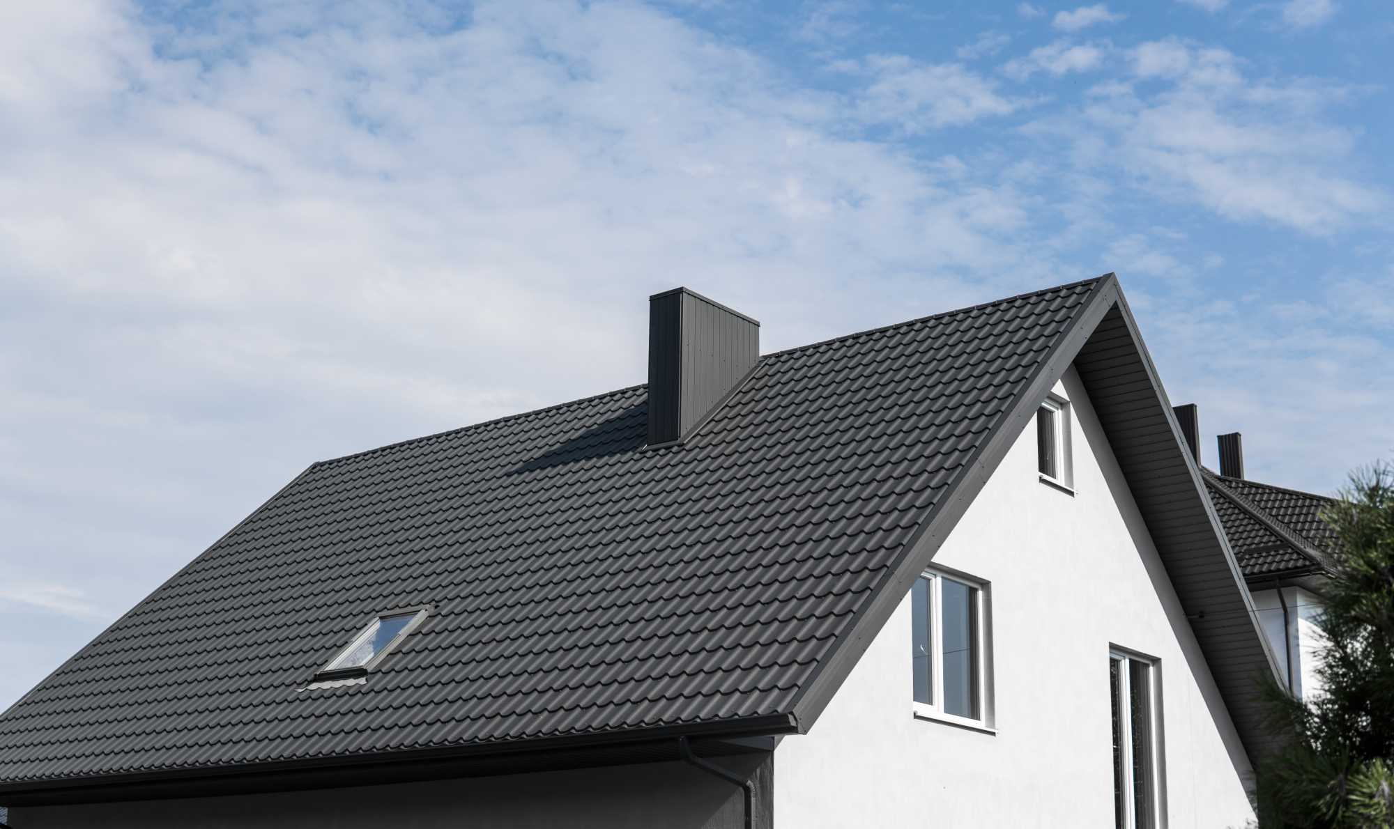 Freshly painted tiled roof on a two-storey home